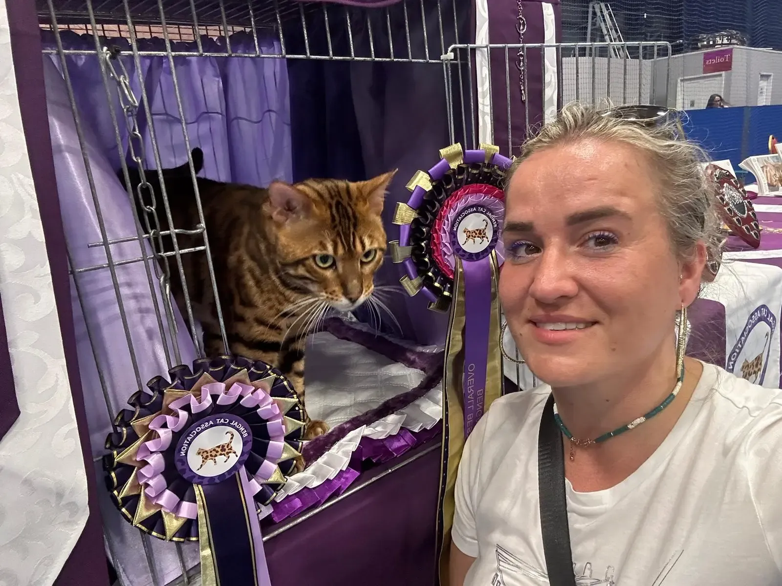 Luxury Rosettes founder with Bengal cat and awards